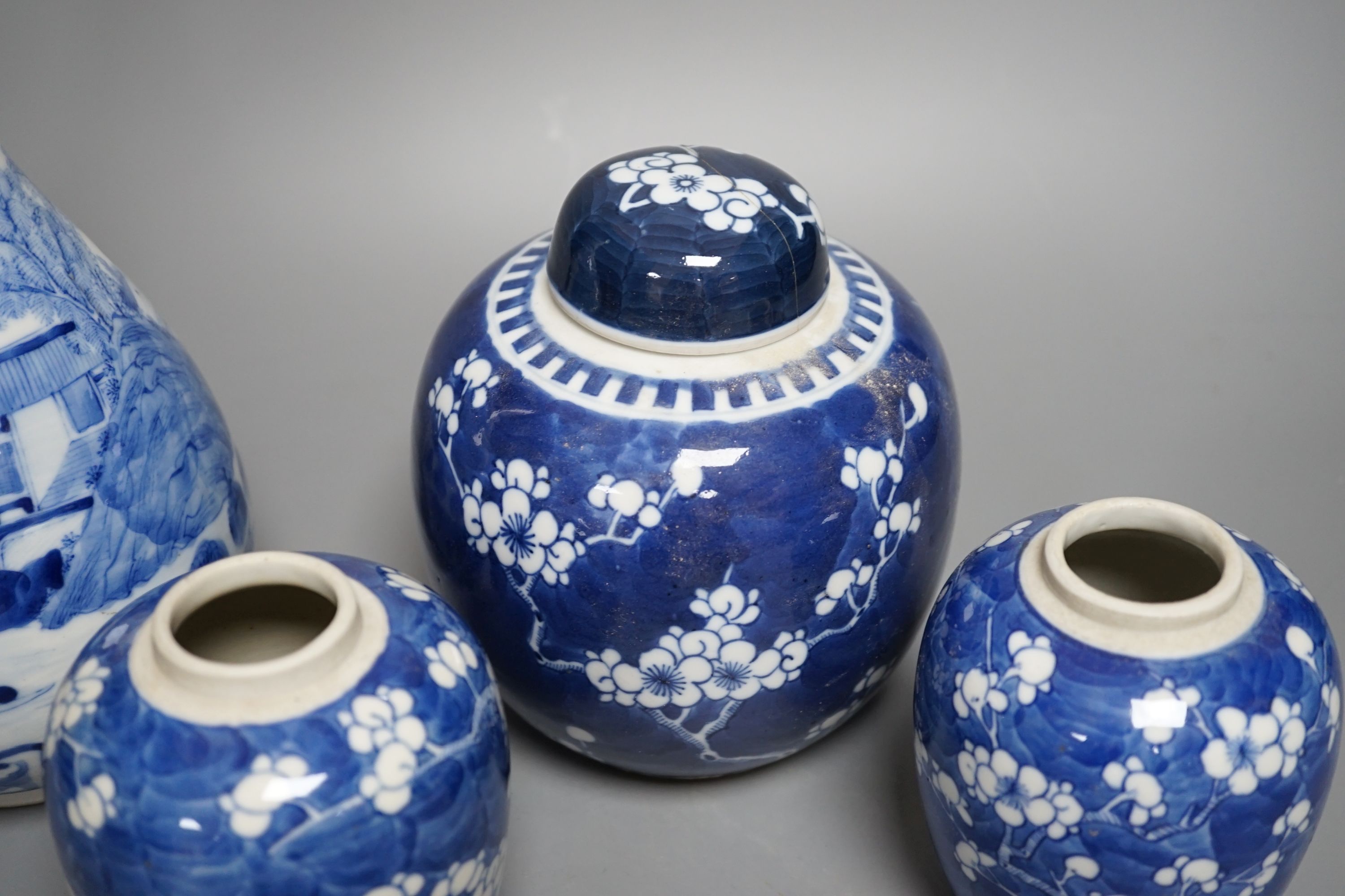 A Chinese blue and white vase and 3 graduated blue and white ginger jars, Vase25 cms high.